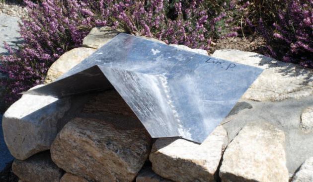 Rather than beating a piece of lead into a lumpy shape over the intersection, I had a piece of custom flashing made.