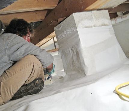 To make sure they sealed every joint, they worked the piers as a team, positioning themselves on each side; this also reduced unnecessary movement on the membrane as the mastic set up.