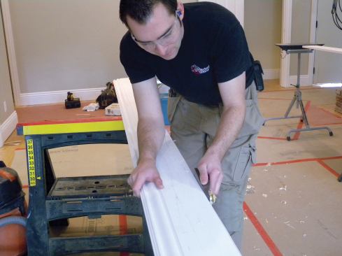 Using a low-angle block plane to fine-tune the cut.