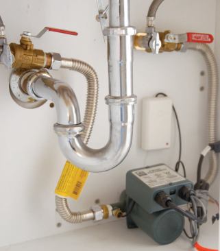 On-demand hot-water kits are small enough to fit in a bathroom vanity cabinet.