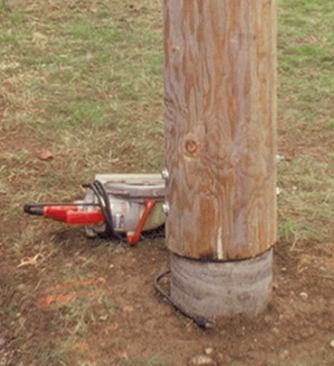 Because log posts are vulnerable to rot from water wicking up the end grain, the author makes the top of the footing 2 inches smaller than the post to provide a drip-edge.