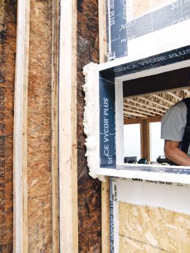 The gaps around the window bucks were insulated with spray foam.