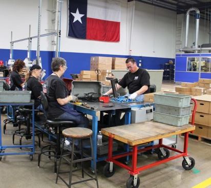 These folks are doing the final assembly and adjustment of wire strippers—tasks people can do better than robots 
(click here for video
).