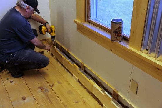 Blocks are glued and screwed to the top of the face board aligned directly over the base blocks. Butt blocks (visible in the foreground) join the lengths of board to complete the face.