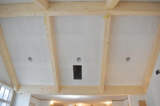 Installed carefully to follow the layout plan, the beams frame the ceiling. 