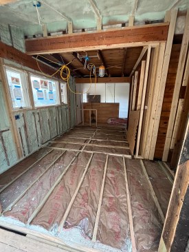 Once all the structural work was completed, the exterior walls, roof, and floor were insulated.
