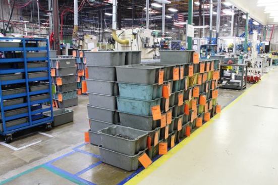I wish I had the contract to provide plastic bins to Leatherman, because they use a lot of them in the factory. These bins contain partially processed pieces. The orange tags on the bins contain information about what is in the bins and a bar code that can be scanned as the bins move around the plant so the operators know where batches of pieces are and what has been done to them. You see these stacks of bins all over the place.