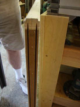This particular door slab came from the supplier with grooves cut on the bottom edge for the door-sweep weatherstripping.