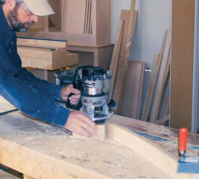 Since I oversized each section, the bearing on my router bit had plenty of clearance while I profiled each piece; to prevent the router from tipping, I screwed a block of wood to the router base.