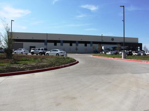 This is the heat-treating plant on the day of its grand opening. You can’t tell from here, but it’s big—by my estimate 250 feet wide by 200 feet deep (50,000 square feet). The building where tools are machined and assembled (The Advanced Manufacturing Technology Center) is by my estimate about 125,000 square feet.