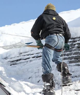 The author puts safety first when mounting roofs to remove snow and ice.