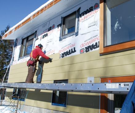 After the sheathing was wrapped with housewrap, window and siding installation was typical.