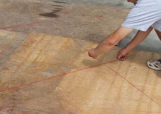 I now had endpoints for the rays marked on the sheets of plywood, so I snapped lines through the marks.