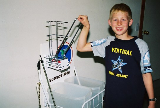 Young Berens with his "souped-up recycling bin," the Ecobot 3000.
