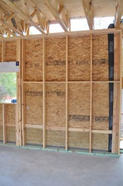 24-inch-o.c. 2×6 studs lined up nicely with the load path of the trusses above.