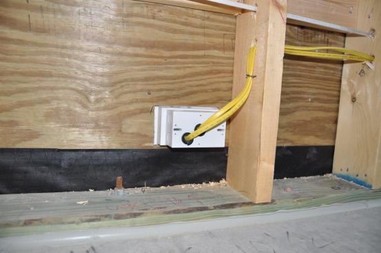 Next it’s time to flash them with the correct flashing tape. I’m using Cosella Dorkin here so this is their flashing tape. Now I can either caulk the box to the stucco or Not. I typically don’t caulk them.