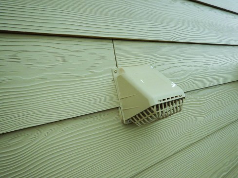 Siding breaks above penetrations like this dryer vent invite water right into the penetration hole and could allow water to leak inside the house.