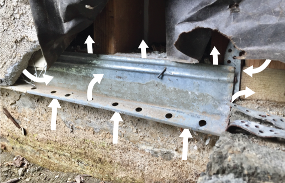 There was no shear wall in this assembly (above left). Stucco was troweled over wire and tar paper stapled onto framing. The stucco is broken away to reveal the many ways that air can enter the wall cavity (white arrows). This build-up cannot be sealed from the exterior.