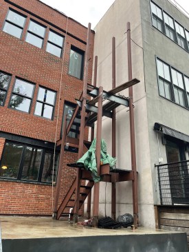 The fire escape has started to shape up while the second and third floor additions will be framed up. 