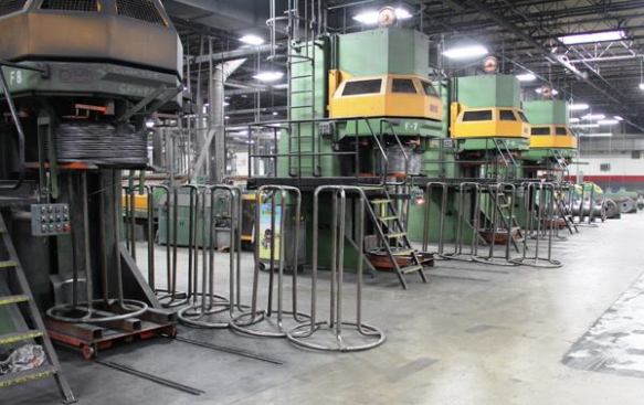 These wire winding machines recoil the wire after it has been drawn and cleaned. The coils that come off of these machines are ready to be made into fasteners. 
Click here for video.