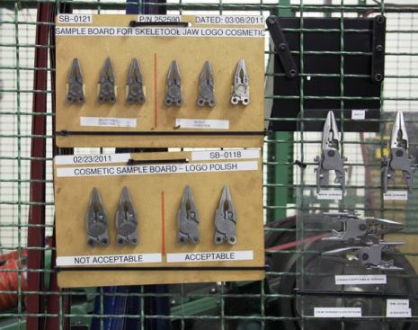 Quality control is an important part of production process, be it carpentry or tool-making. These sample boards are hung on the guard cage as a reminder—though really, everyone who works in the production cell can tell by looking when something is not right. Just in case, samples are pulled during various stages in the production process and sent to an area where technicians measure parts and examine them under a magnifying glass to make sure they are within spec.