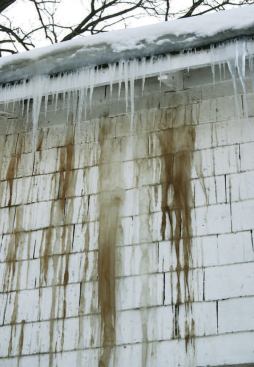 Tannin stains on the siding of this home are unmistakable evidence that lumber in the structure is being drenched with snowmelt.