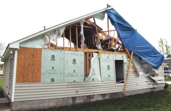 A nearby home used plywood corner bracing and foam infill.