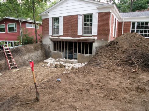 Once the opening was cut, the crew broke the concrete slabs into manageable pieces.