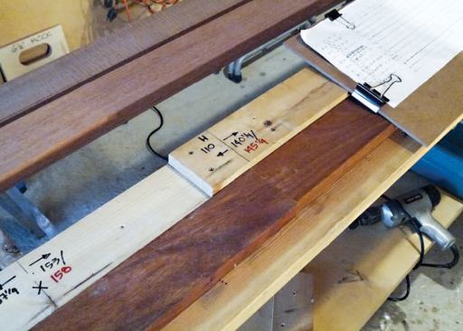 The cut station was parallel to a layout bench where he transferred the layout marks from the story poles to the decking for crosscutting and predrilling.