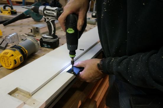 Because the story pole was used to layout the hinges on the door slab as well as on the jamb, the hinge leaves can be screwed in place without worry of alignment problems later.