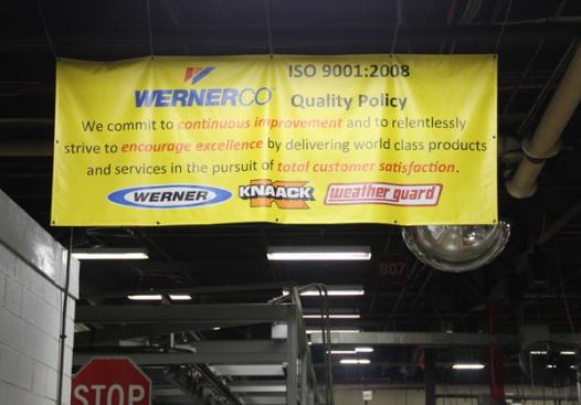 This banner hangs over the entrance to the factory floor. The Werner Company (Werner Ladder) bought Knaack and Weather Guard in 2012 from Emerson, the industrial conglomerate that currently owns the Ridgid brand.