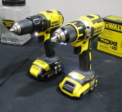 On the left is the DCD780, a brushed drill/driver that came out in 2011. To the right is the DCD790, a brushless model that has just been released. The brushed model is shown with a 1.5 Ah battery; the brushless with a 2.0 Ah XR pack. The LED light is above the trigger on the earlier model – a less desirable location given that it will cause the chuck to shadow the beam. On the newer tool, the light projects up from the base so the chuck won’t shadow it.