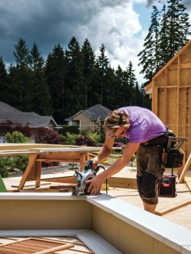 We install fly rafters and any trim, cutting in place and scribing the miters for a perfect fit.