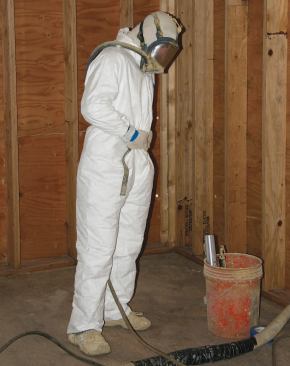 A supplied-air respirator is a must when spraying foam. A layer of clear plastic wrap keeps the face shield clean for repeat use.
