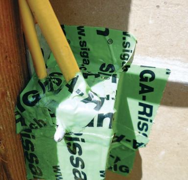 Leaky metal boxes exposed in the course of a retrofit can be sealed to the back of the drywall with tape.