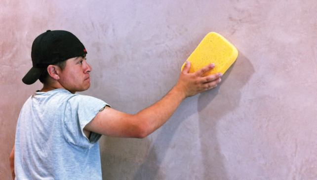 Before pulling the 6-mil poly, we buffed the entire plaster surface with dry grouting sponges.