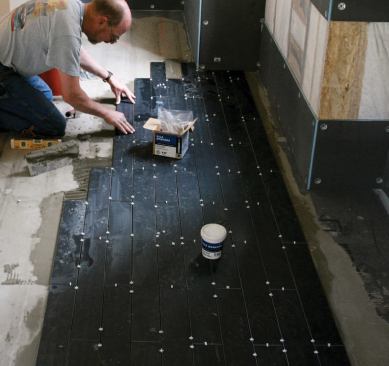 Later, the floor is tiled with porcelain planks ripped from 12-inch-by-24-inch tiles.