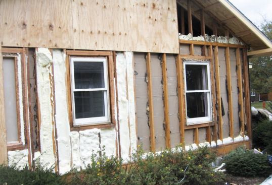 With siding and sheathing removed, potential leaks in the plates were easily sealed with foam. Also, as a preventive measure, the exterior bathroom wall was foamed.