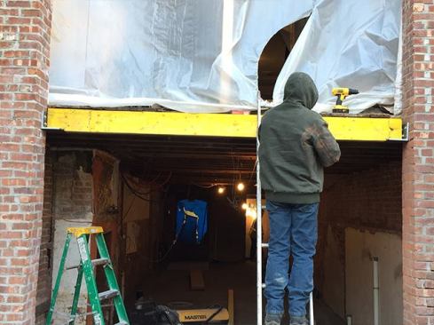 We needed to frame out the masonry opening to receive the new doors. Rather than infilling with a bunch of 2-by stock, we decided to install a couple of LVLs. We ripped the LVLs to match the existing joist depth, taking off about ¾ inch. We weren’t too concerned about compromising their structural integrity; in this case, the LVL was essentially acting as blocking. However, the clients are thinking about adding a deck off the kitchen in a year or so. The LVL will provide good anchoring for a ledger, if they choose to do this.