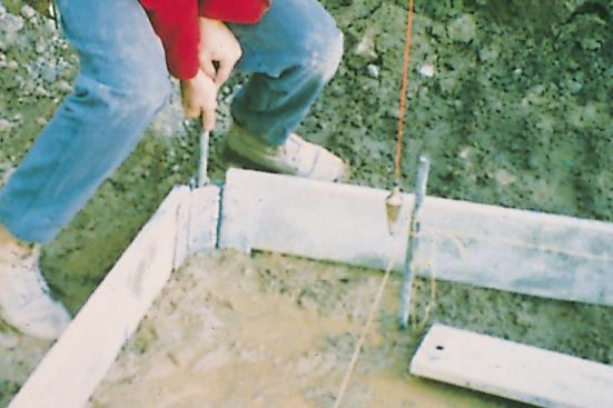 If a form stake sinks in too easily, the soil may be too soft. For localized soft spots, the author recommends widening the footing. In wet, mucky areas, he recommends compacting large cobbles into the mud to provide bearing.