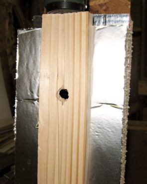 At maximum load, the head has pulled halfway through the strapping.