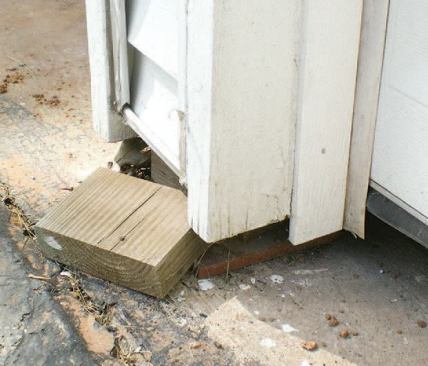 Gaps beneath the garage door and structure were tell-tale symptoms of the slab settlement.