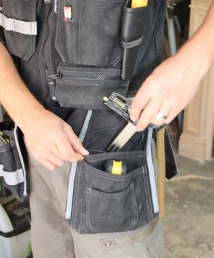 On the lower left front side are a series of pouches, each slightly deeper and narrower than the next. I’ll put fasteners or larger tools in the back one and smaller tools in the middle one. The small front pocket is used for one item only – foam ear plugs. I keep them there because it makes them easy to get at.