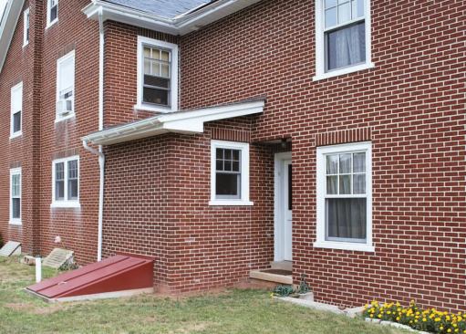 After: A 48-square-foot addition on the back corner of this brick home created a larger rectangular space for the kitchen. The project required removing the first-story structural brick wall in the inside corner and supporting the second story with steel beams.