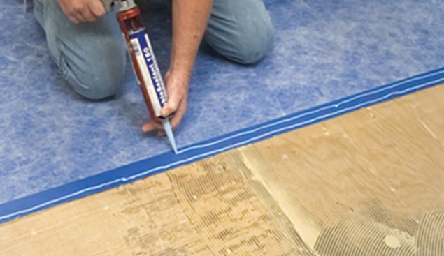 For a flat and leakproof seam in the sheet membrane, the author lays down two beads of manufacturer-supplied sealant.