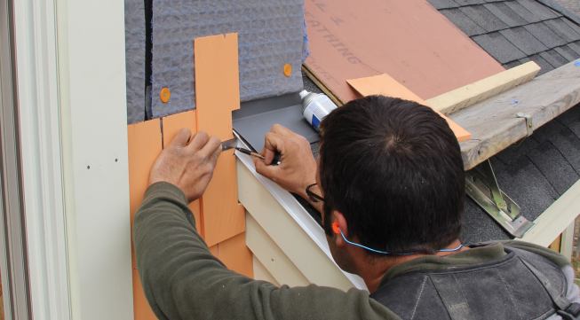 Pollard uses a small steel rule to accurately adjust his scribe line.