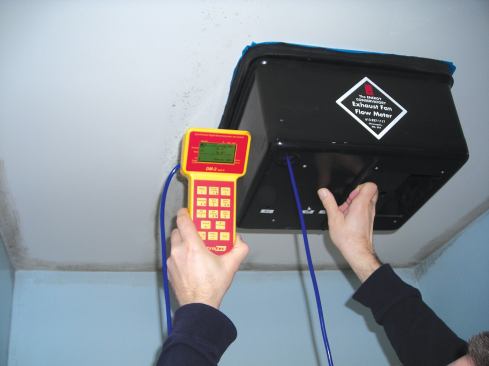 The author checked the airflow of the two fans using a duct hood and a manometer. He found that the fans were working at only about 60 percent of their rated 70-cfm capacity.