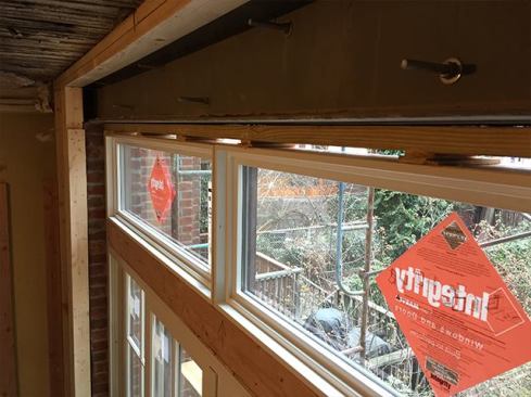 With doors and transom shimmed, we began framing out the opening, which will get boxed out in drywall and trim (see next slide).