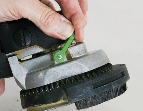 A quick-release lever makes it easy to remove and adjust the Festool's extractor hood, but an inadvertent bump can knock everything out of alignment.