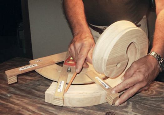 With this setting locked into place, I place the protractor against the fitting and align the lower blade with the bottom cut on the easing. I then mark the upper cut where the pivot arm touches the easing.